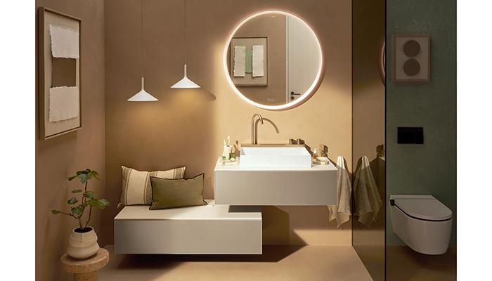 Hansgrohe's Xarita S mirror is shown with the Avalegra washbasin in a warm, Mediterranean-inspired roomset