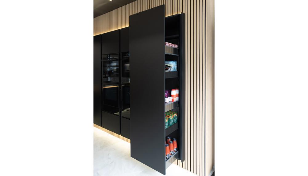 Masterclass Kitchens&rsquo; super-sleek H-Line Amalfi Onyx with Legrabox MagnaSpace Pull-Out Larder unit shown here in a project by Kingswell Kitchens, Chichester, is an ideal storage solution for those after clean lines and a professional look